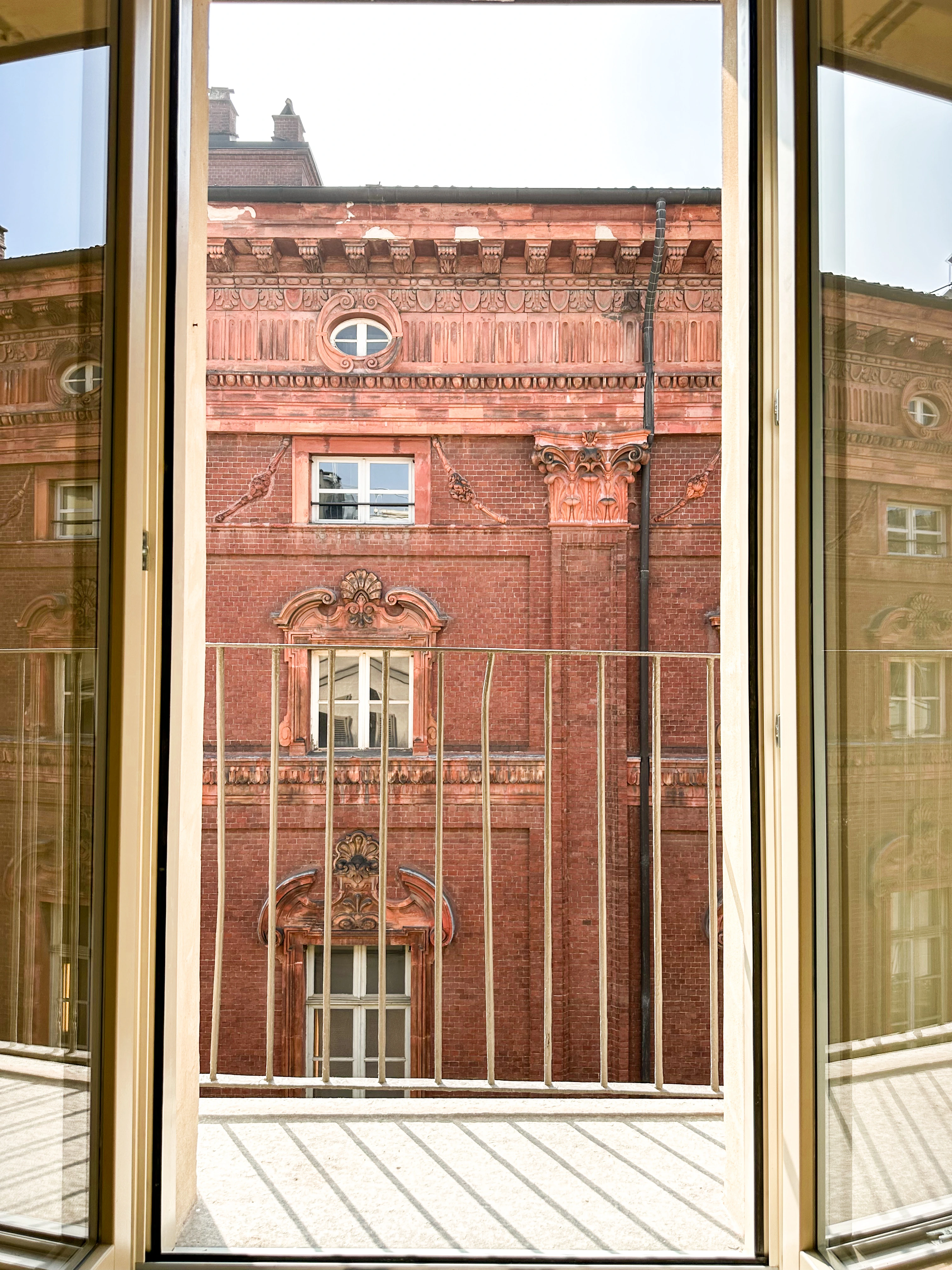 The balcony of the boutique stay at Casa Vermouth overlooking Turin